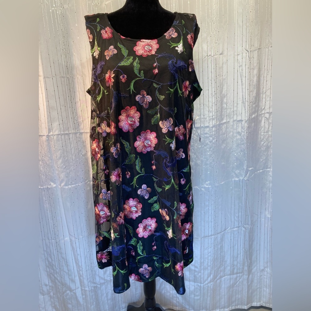 Pretty black dress with floral overlay.